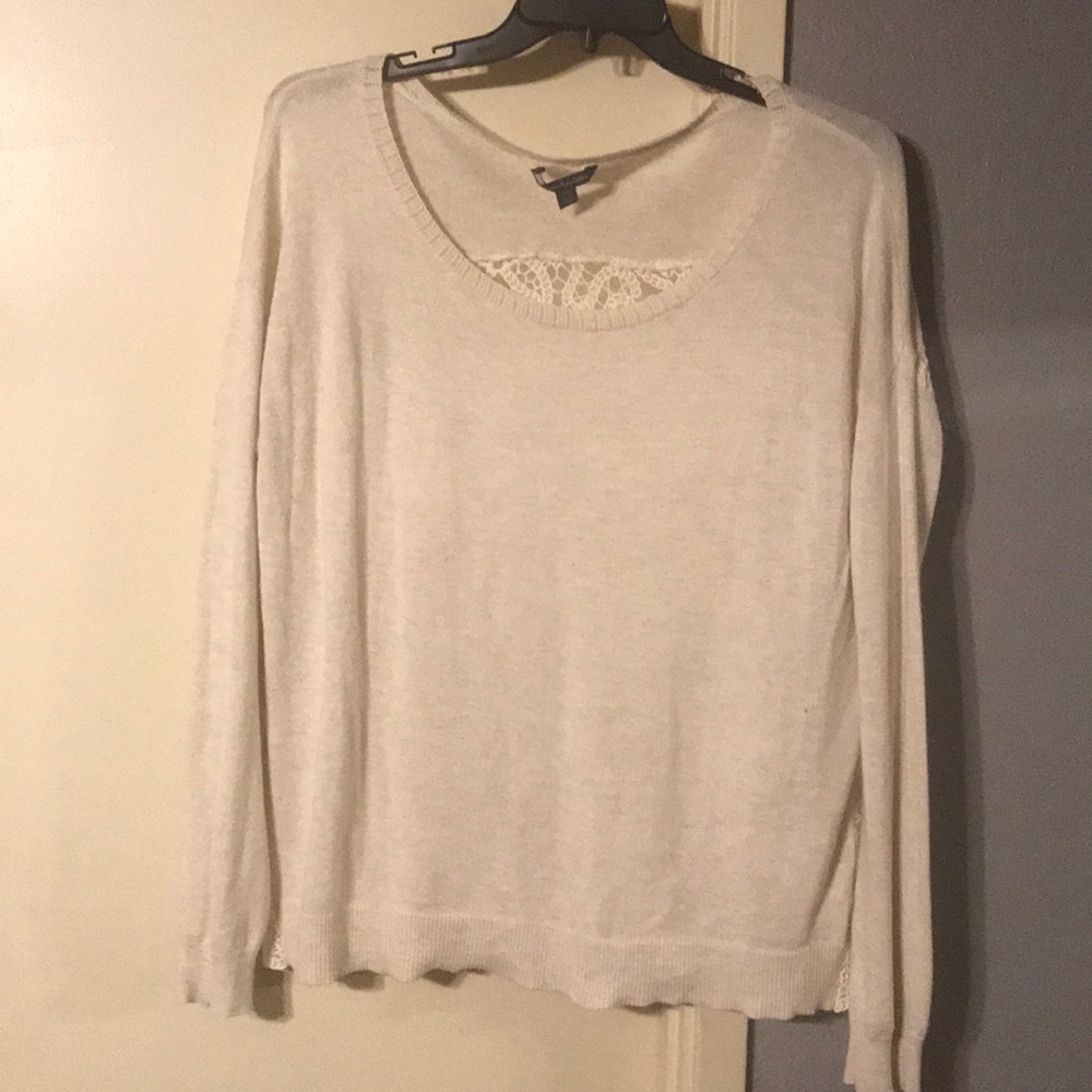 Light weight sweater, w/ lace detail on the back.